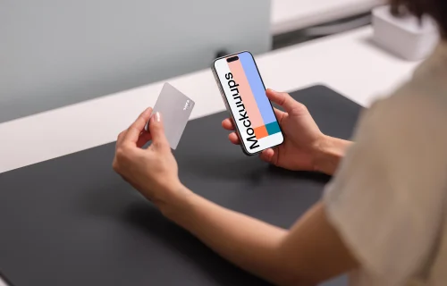 Free iPhone 15 Pro mockup with credit card in hand