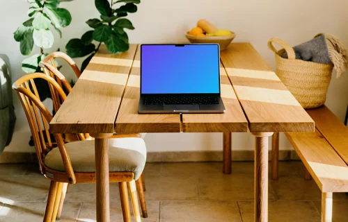 Grey MacBook Pro mockup on a wooden table
