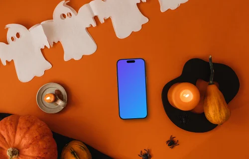 Halloween background mockup with a phone and pumpkin