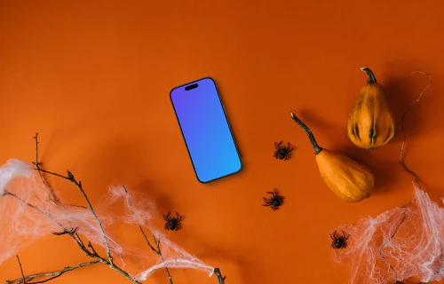Halloween background mockup with a smartphone and spiders