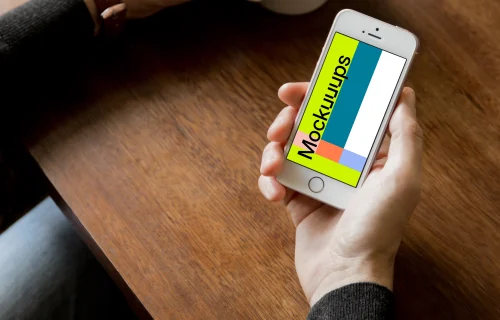 Holding iPhone SE mockup and drinking black coffee