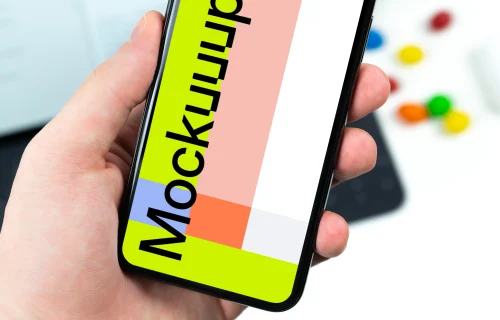 Holding iPhone XS mockup