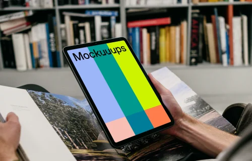 iPad Air mockup held by user in a library