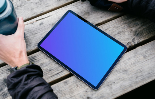 iPad Air mockup help by a use outdoors 