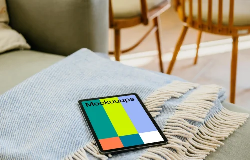 iPad Air mockup lying on a folded blanket 