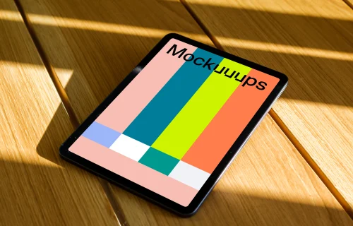iPad Air mockup on a wooden table in the sunlight