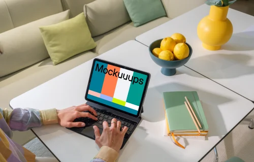 iPad Air mockup with woman's hands on home office desk