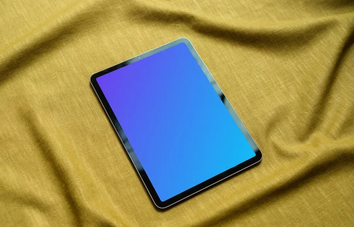 iPad mockup on a yellow tablecloth