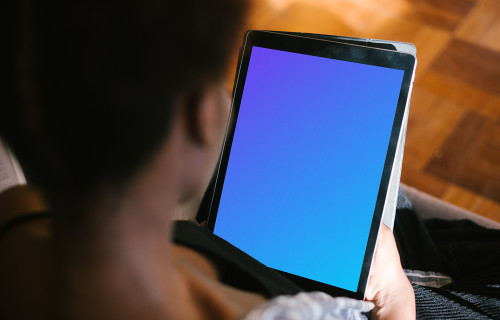 iPad Pro mockup in a dark-skinned lady's hands