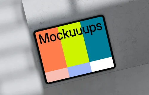 iPad Pro mockup placed on marble surface with shadows