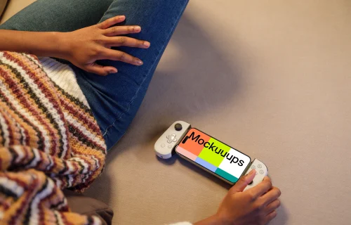 iPhone 15 Pro mockup in a casual gaming setup