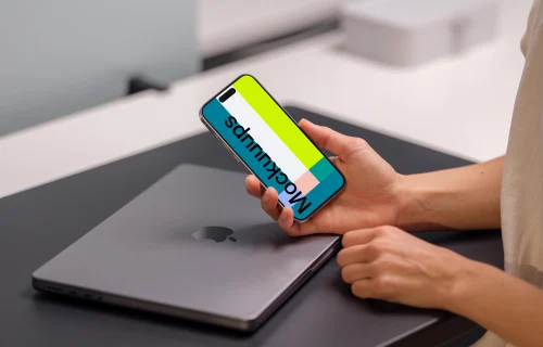 iPhone 15 Pro mockup with a professional workspace