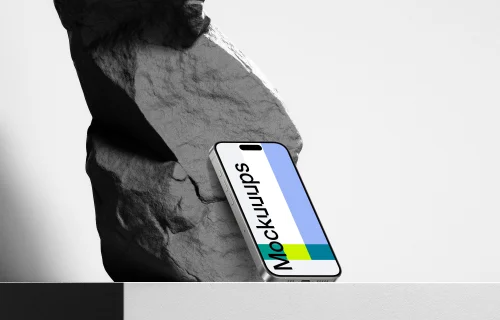 iPhone 15 Pro on Rock Mockup