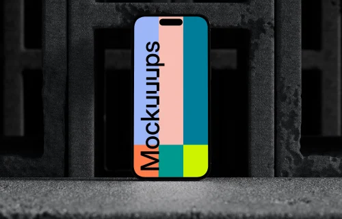iPhone 16 mockup with concrete blocks backdrop