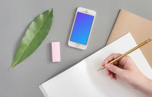 iPhone SE mockup next to the journal