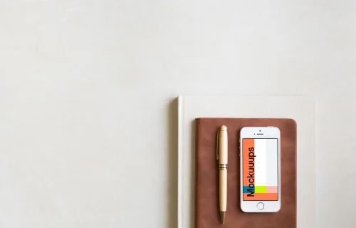 iPhone SE mockup placed on leather journal