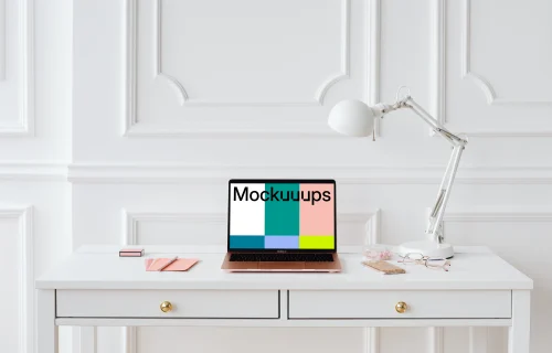 MacBook Air mockup on a table beside an iPhone