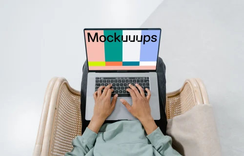 MacBook mockup on a user's laps