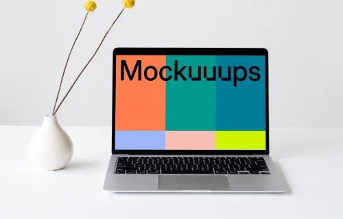 MacBook mockup on a white table