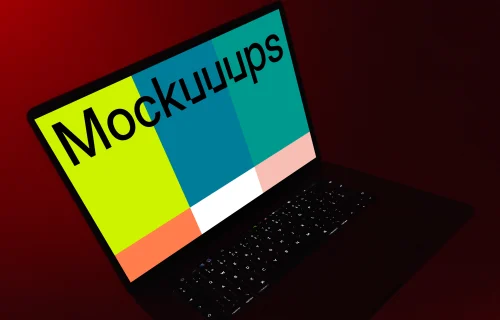 MacBook night mockup held under red light