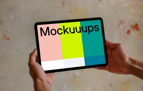 Male hands holding iPad mockup