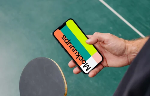 Man typing on an iPhone 13 mockup