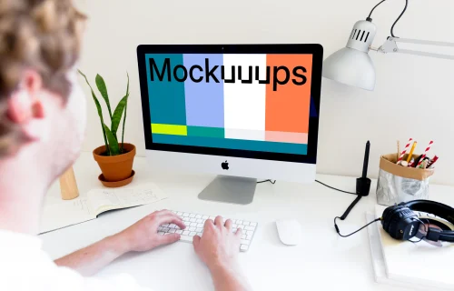 Man working on iMac mockup