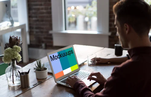 Man working on Macbook Air mockup