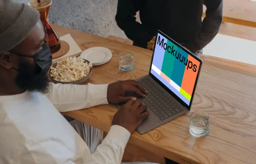Microsoft Surface laptop mockup on a restaurant table