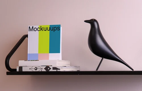 Mockup of a square book on modern shelves with ceramic decor