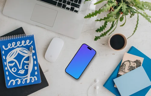 Free mockup of smartphone device with a MacBook on the side