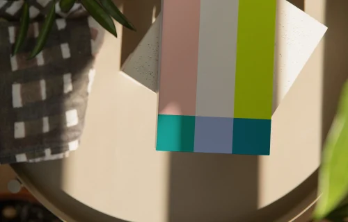 Paperback mockup on a round table with plants