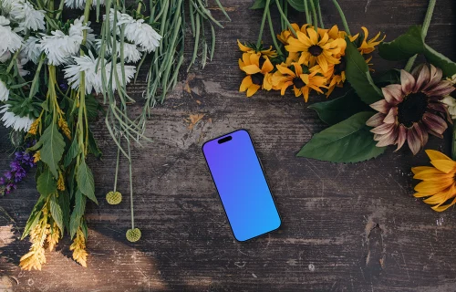 Phone mockup next to flowers