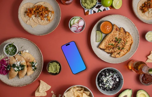 Phone mockup surrounded by Mexican food