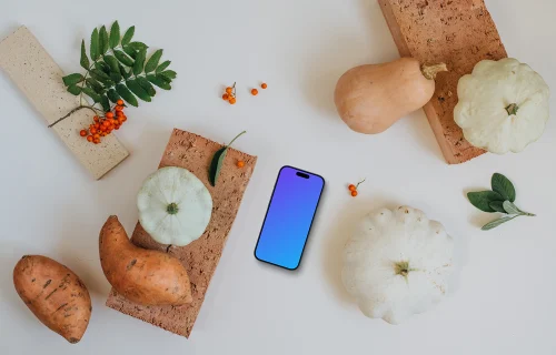 Phone mockup surrounded by vegetables
