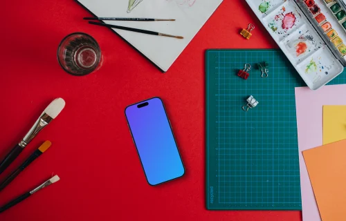Phone mockup with painting accessories around