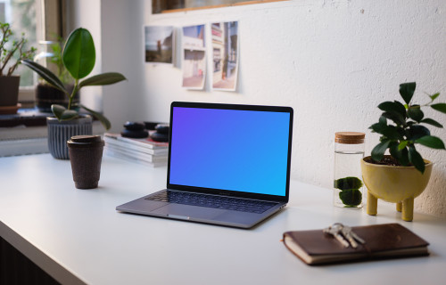 Side view of the Macbook Pro mockup on white table