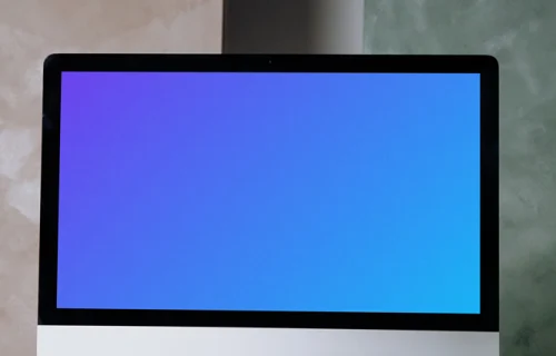 Simple iMac mockup on a white table with a wireless keyboard and a mouse