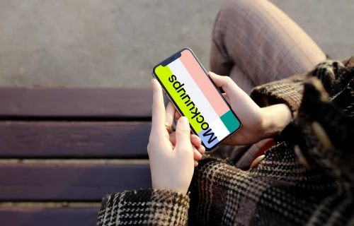 Sitting with iPhone X mockup