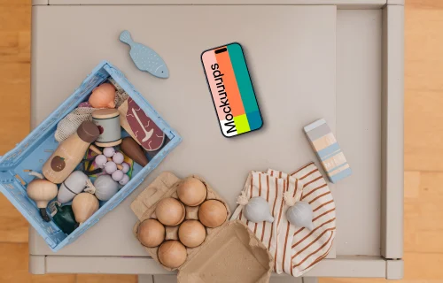 Smartphone mockup among children's toys