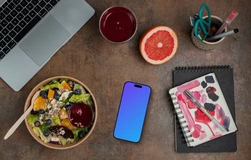 Smartphone mockup next to the delicious salad