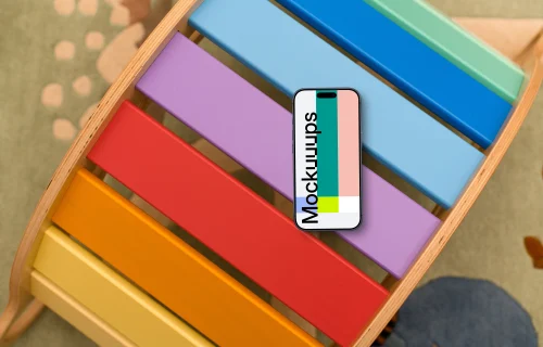 Smartphone mockup on colorful child's play table