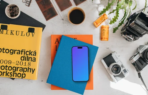 Smartphone mockup placed on colorful books