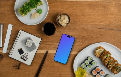 Smartphone mockup surrounded by sushi and decorations