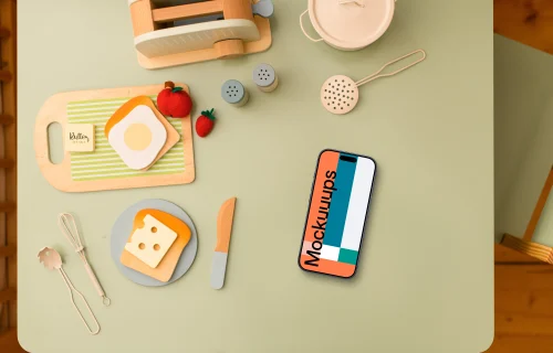 Smartphone mockup with children's play kitchen accessories