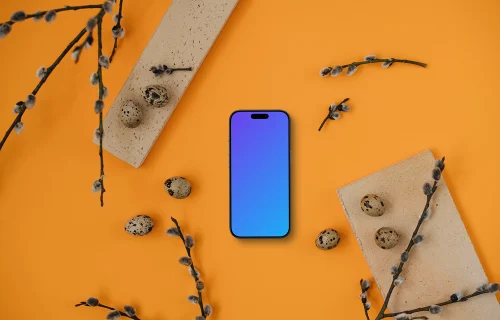 Smartphone mockup with Easter theme on an orange table