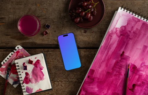Smartphone with watercolor painting in Viva Magenta shade