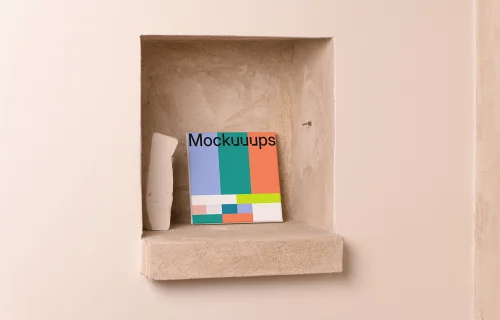 Square poster mockup on a beige recessed shelf