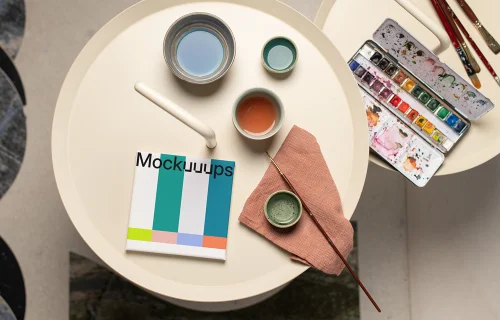 Square poster mockup with colorful palette and brushes
