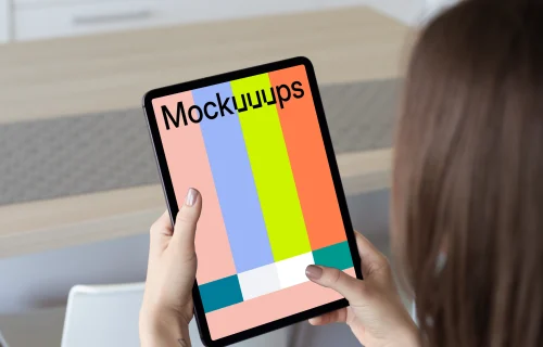 Tablet mockup held by lady in a kitchen